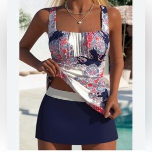 a two-piece swimwear set of a patterned tankini top navy blue swim skirt.